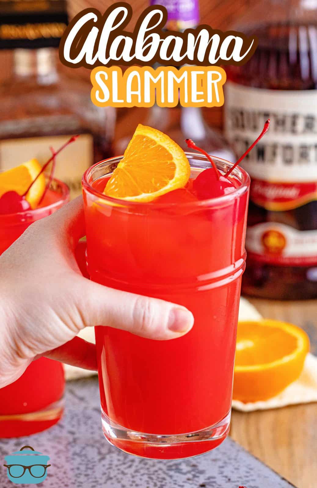 Pinterest image with hand holding one Alabama Slammer.